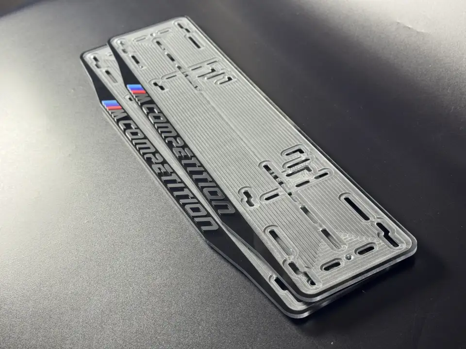 BMW M Competition · чёрные рамки Пара чёрных номерных рамок BMW M Competition с M-полосками